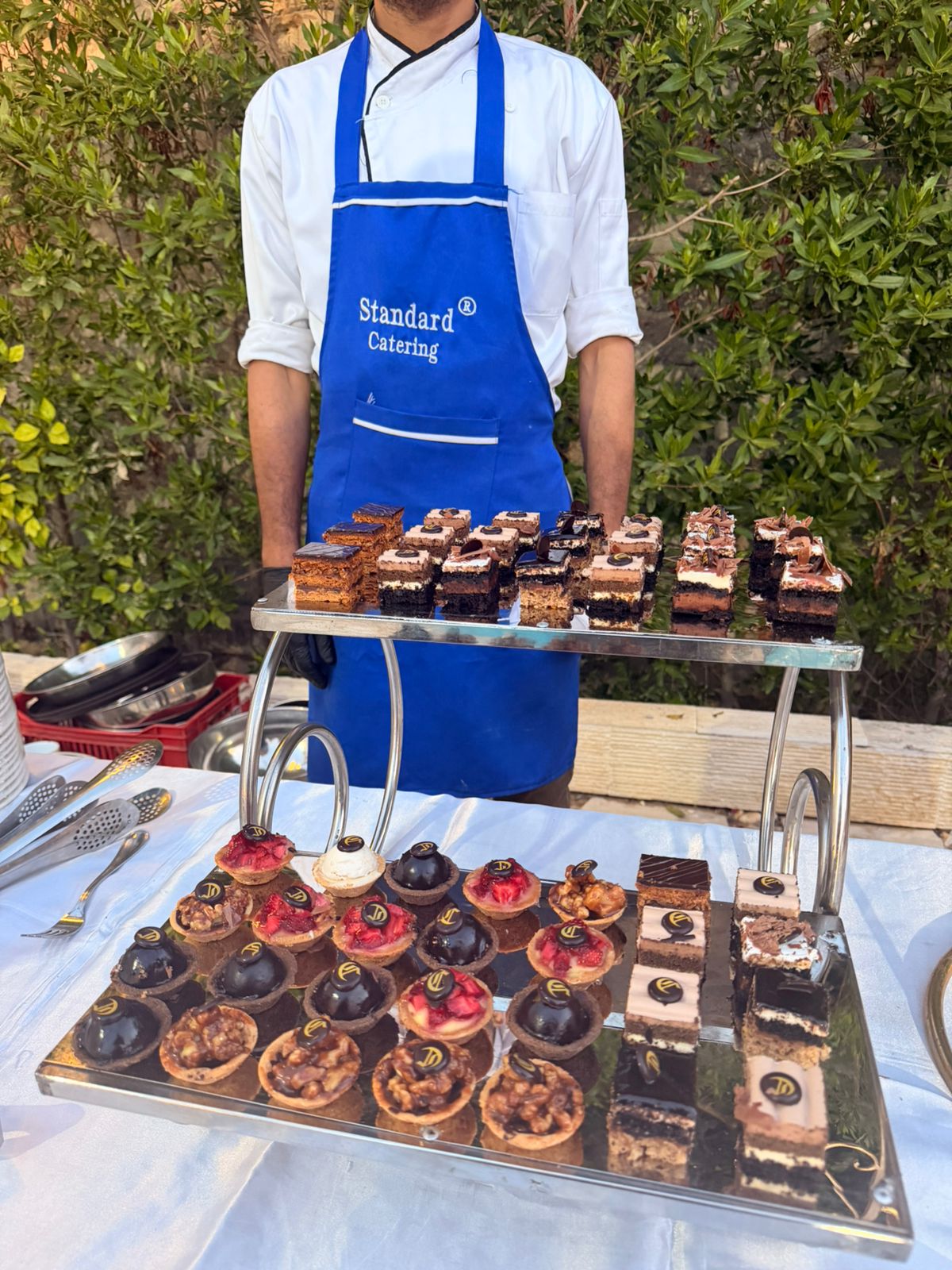 Caterer arranging a food spread